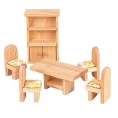 a wooden table with chairs and a bookcase in the shape of a doll house