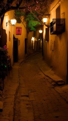 an alley way at night with lights on