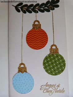 three christmas ornaments hanging from a tree branch on a card that reads, august's the merry nativity