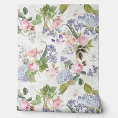 a floral wallpaper with pink, blue and white flowers on it's side