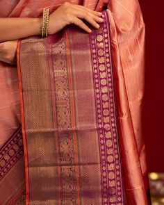 Navratri Edition Featuring a classic and sophisticated blush pink twill kanjivaram silk saree, meticulously crafted with intricate silver and gold zari stripes and buttis throughout the saree. The saree is elegantly complemented by a korvai woven purple varisaipettu araimadam, motifs border, enhanced by a contrasting orange selvedge and a luxurious zari pallu. Saree code: CL340376 Orange Kanchipuram Saree, Saree Inspiration, Kanchi Sarees, Kanjeevaram Sarees, Lavender Silk, Kanjivaram Silk Saree, Saree Border, Kanjivaram Sarees, Kanchipuram Saree