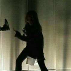 a woman is walking in the dark with her cell phone