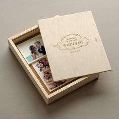 two wedding photos in a wooden box with the lid open to show it's inside