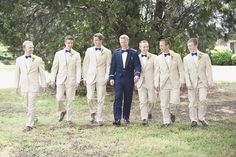 a group of men in suits standing next to each other