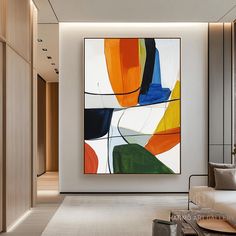 an abstract painting hangs on the wall above a white couch in a modern living room