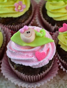 cupcakes decorated with pink and green frosting