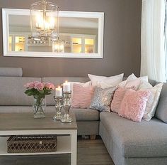 a living room filled with furniture and a chandelier