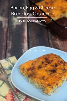 bacon, egg and cheese breakfast casserole on a blue plate with a fork