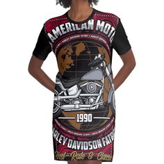 a woman wearing an american motorcycle t - shirt dress with her hands on her hips