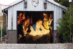 a garage with a nativity scene painted on it