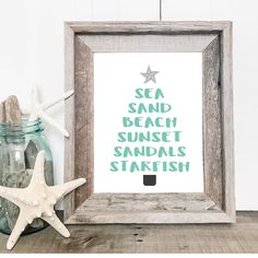 a starfish sits next to a framed print with the words sea, beach, sunset, sandals, and starfish