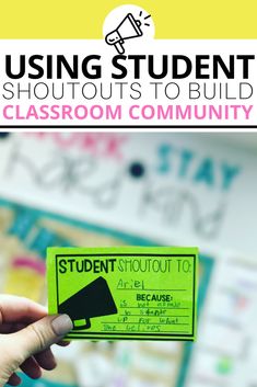 a person holding up a green student's classroom community card with the words, using student