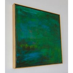 a green painting hanging on the wall