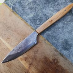 a knife is laying on top of a cutting board