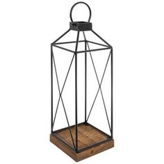 a black metal and wood lantern with a wooden base on an isolated white background for display