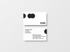 two business cards with black dots on them