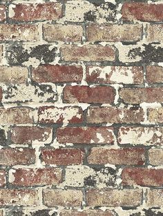 an old brick wall with red and white paint