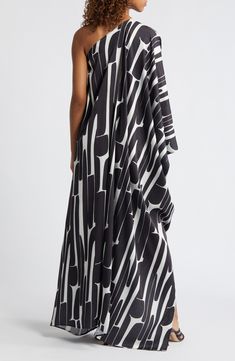 A stunning abstract print enlivens the flowing jacquard fabric of this lightweight one-shoulder dress handcrafted in a small atelier in Dakar, Senegal. Each piece is designed for longevity. Every garment is made-to-order to reduce production waste. One-shoulder neck Long sleeve 100% polyester Machine wash, line dry Made in Senegal Black Owned/Founded Small Atelier, Dakar Senegal, One Shoulder Cocktail Dress, Convertible Dress, Long Sleeve Maxi, Maxi Dress Blue, Jacquard Fabric, Printed Maxi, Nordstrom Dresses