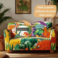 a couch with dinosaurs on it in a living room next to a potted plant