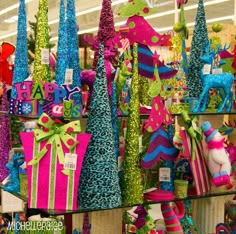 there are many colorful hats on display in the store