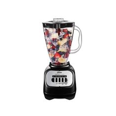 a blender filled with fruit on top of a white background