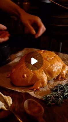 a turkey sitting on top of a wooden cutting board