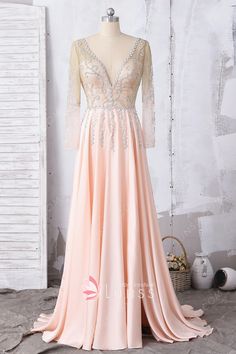 This A-line long evening prom formal dress features elegant beaded bodice with illusion long sleeves, deep V neckline and V back with invisible zipper closure, flowing peach pink satin faced chiffon skirt with side high slit and short train. Light Pink Prom Dress, Tight Prom Dresses, Damas Dresses, A Line Prom Dress, Pink Prom Dress, Pink Formal Dresses