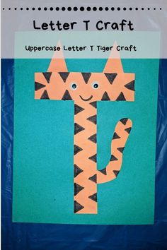 the letter t is made out of paper and has an image of a tiger on it