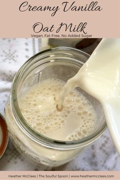 creamy vanilla oat milk being poured into a glass jar