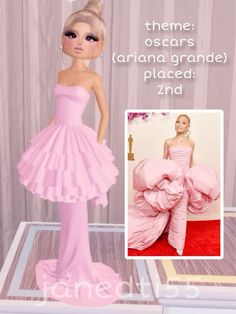 a barbie doll is wearing a pink dress