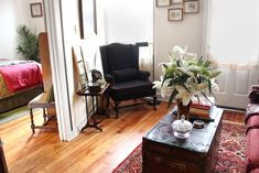 a living room filled with furniture and flowers