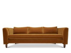 an orange couch with four pillows on it's back and arms, against a white background