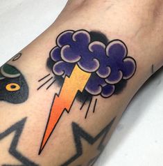 a man with a lightning tattoo on his arm