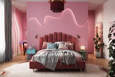 a bedroom decorated in pink and grey with a large headboard on the wall above the bed