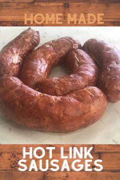 hot links sausages sitting on top of a wooden table next to the words hot link sausages