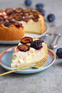 a slice of cheesecake on a plate with a fork next to the rest of the pie