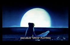 an image of a person sitting on the beach in front of a full moon with text that reads, incubus'drive playing