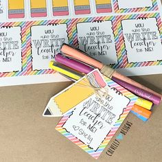 some writing paper and markers are on the table next to it's name tags