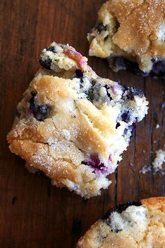 blueberry muffins cut in half on a wooden table