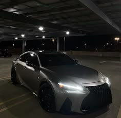 a car parked in a parking lot at night