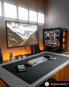 a desktop computer sitting on top of a desk next to a keyboard and monitor screen