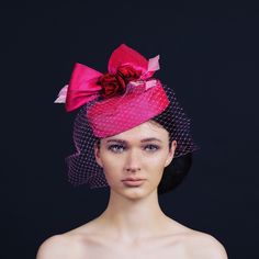 Exquisite hot pink silk pill box with hand craft red silk roses, a bird cage veil and light pink diamond feathers. This statement piece would be excellent for Ascot or mother of the bride. This pink silk pill box hat is handmade in my studio in Exeter. Love this look, but need it in another colour to match your outfit, send us an photograph of your outfit and state the colours you would like for the sinamay, twirls. See colour chart. There will be a £20 surcharge for bespoke items. We look forward to hearing from you. Pill Box Hat, Pink Veil, Casual Hats, Pink Fascinator, Box Hat, Bride Hat, Shocking Pink, Wedding Hat, Birdcage Veil