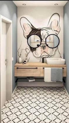 a bathroom with a dog's face painted on the wall next to a sink