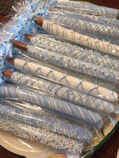 there are many blue and white desserts wrapped in plastic