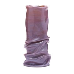 a tall purple vase sitting on top of a white table