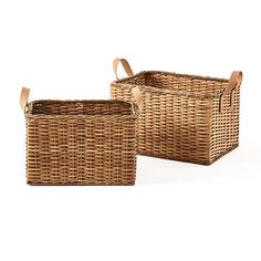 two wicker baskets sitting side by side on a white background, one is empty and the other has a brown leather handle