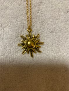 Yellow gold sun pendant necklace Gold Sun Design Round Pendant Necklace, Gold Necklace With Sun Design Round Pendant, Adjustable Sun Design Jewelry, Vintage Gold Jewelry With Sunflower Design, Gold Jewelry With Sunflower Design For Summer, Summer Gold Jewelry With Sunflower Design, Summer Gold Jewelry With Sun And Moon Design, Metal Sun Design Necklace As Gift, Gold Metal Necklace For Summer