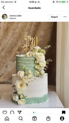 a three tiered cake with flowers and candles