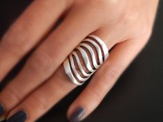 waves-ring Modern Adjustable Rings, Modern Jewelry With Unique Design And Open Band, Modern Jewelry With Unique Design And Open Ring, Modern Adjustable Metal Rings, Elegant Metal Wide Band Ring For Anniversary, Chic Silver Open Ring Jewelry, Modern Metal Wide Band Ring For Anniversary, Modern Twist Jewelry With Unique Open Ring Design, Trendy Silver Dome Ring