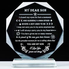 a clear glass award with a poem on the front and back of it that says, my dear son